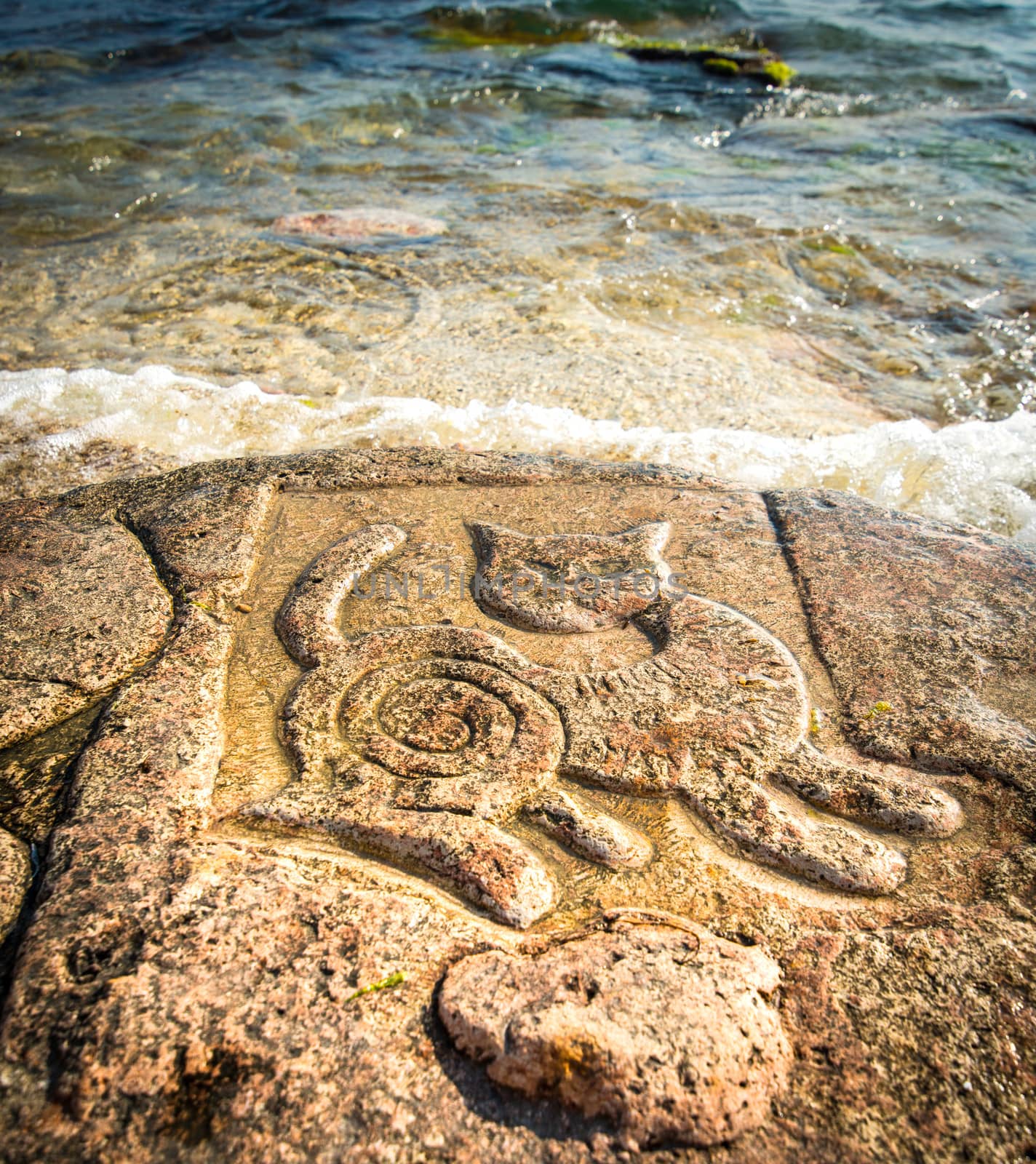 Rock carvings on the beach by GekaSkr