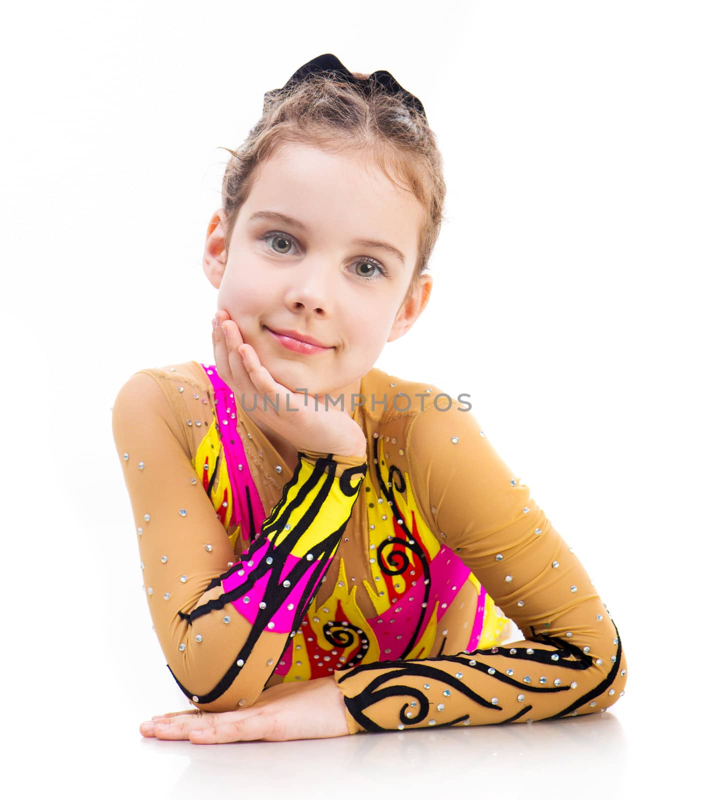beautiful little girl gymnast on a white background
