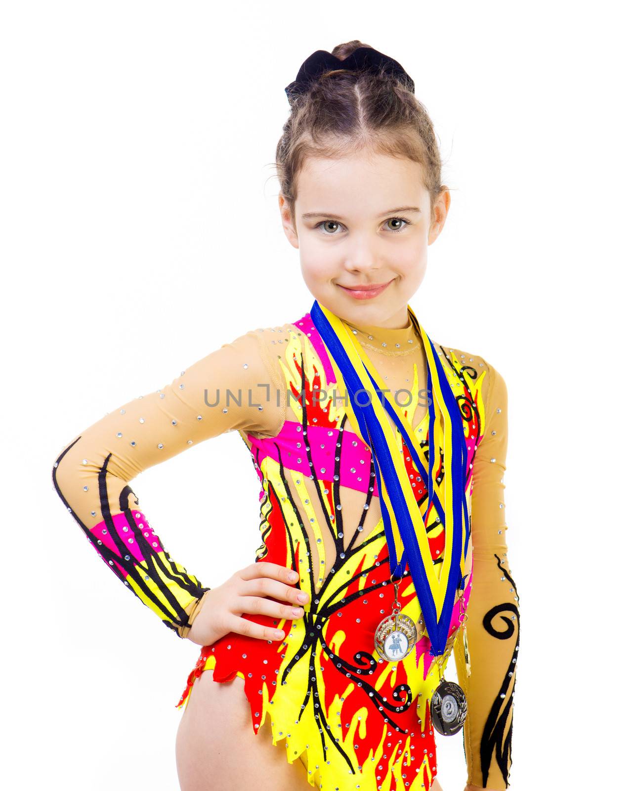 little girl gymnast with a medal on a white background