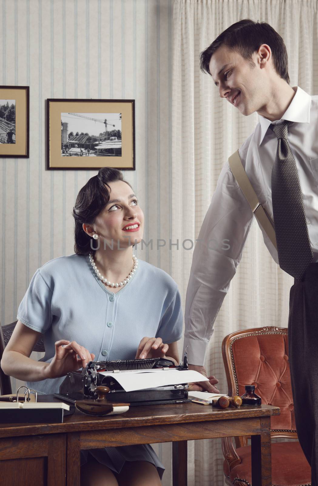 Business partners working in an office, vintage style