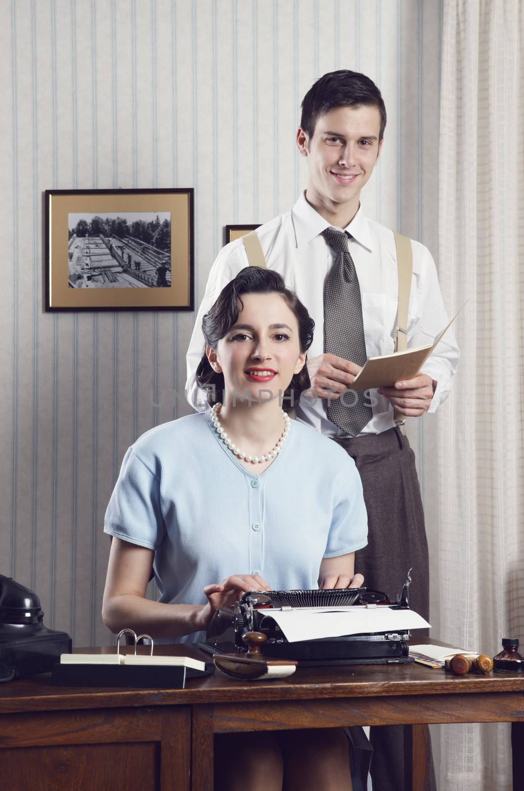 Business partners smiling in an office, vintage style