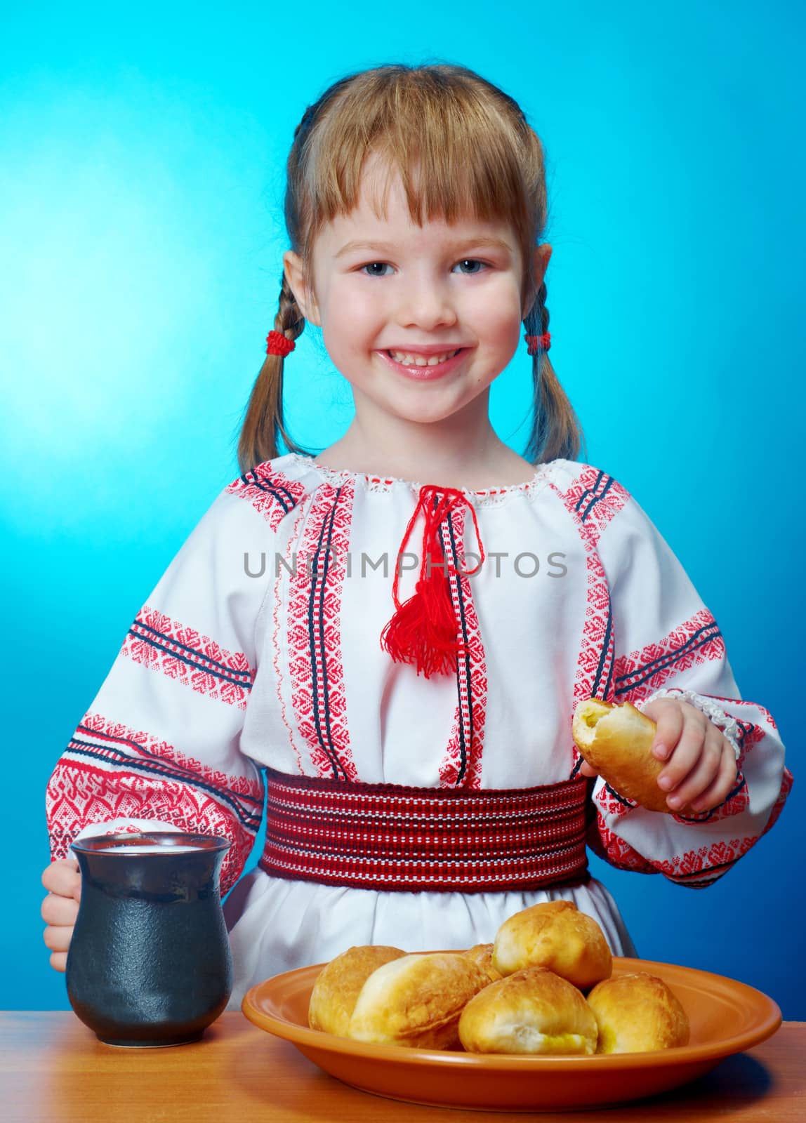 Russian little girl eats homemade pie