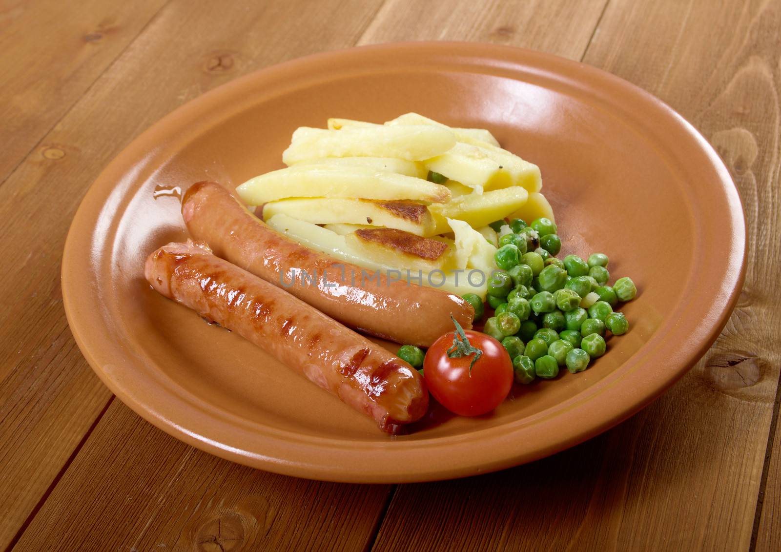 Sausages with french fries and vegetables