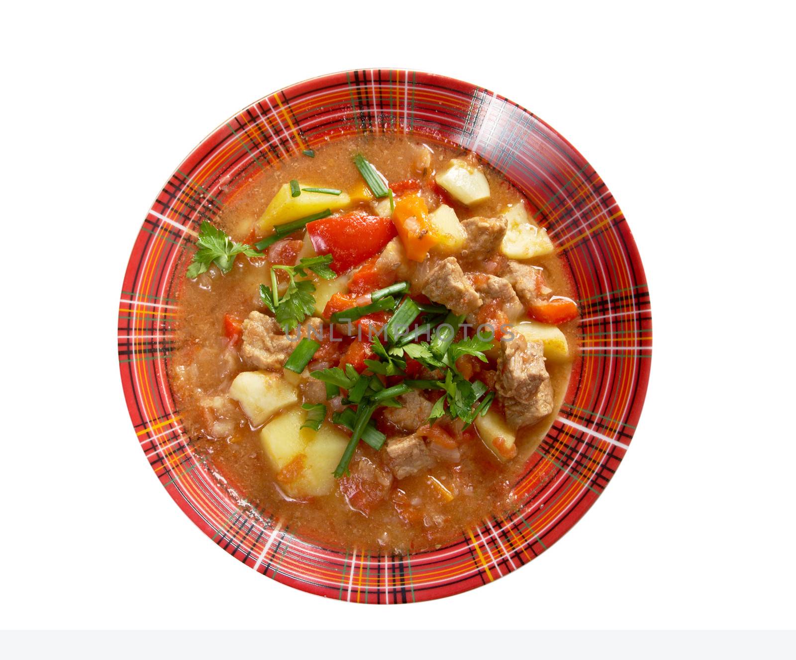 Traditional Hungarian homemade hot goulash soup.isolated on white background. 