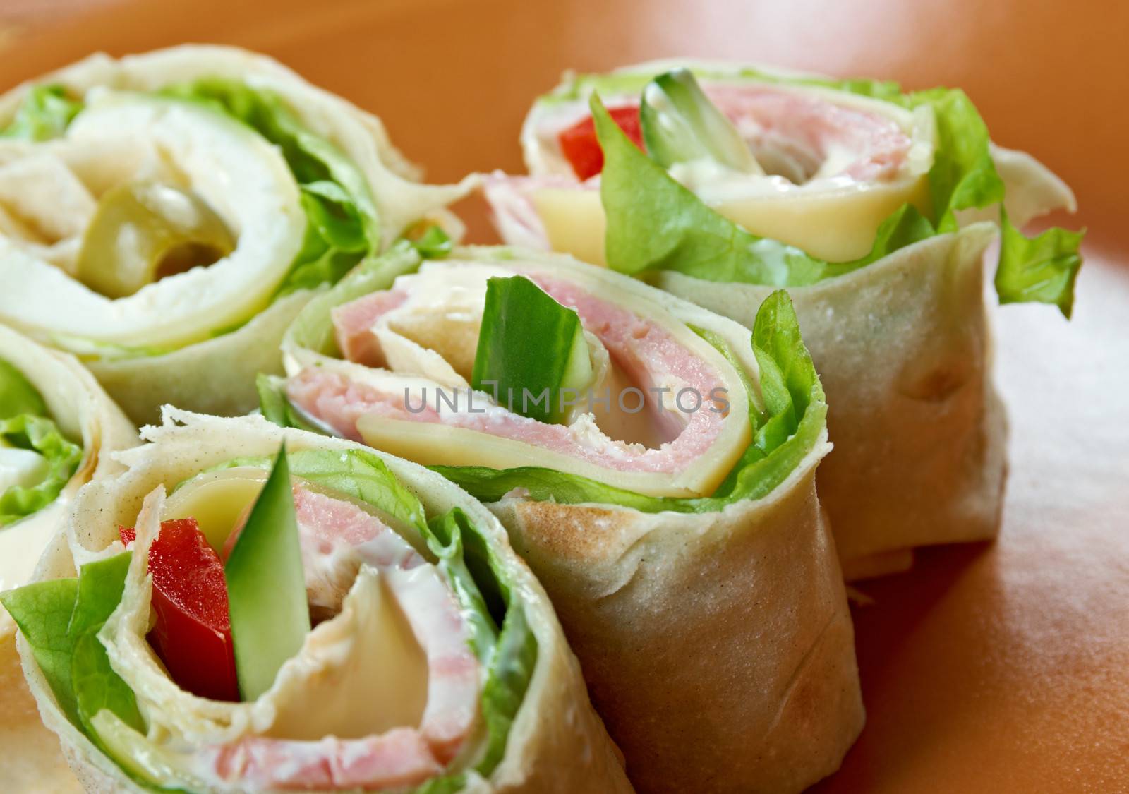 healthy club sandwich pita bread roll with cheese,ham,parsley