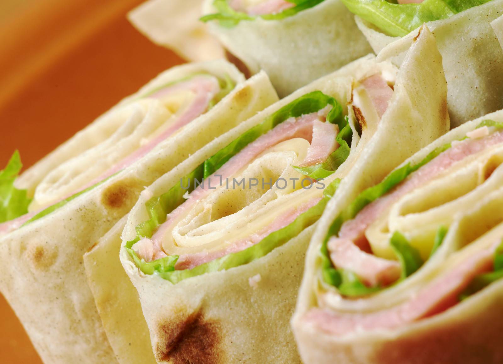 healthy club sandwich pita bread roll with cheese,ham,parsley