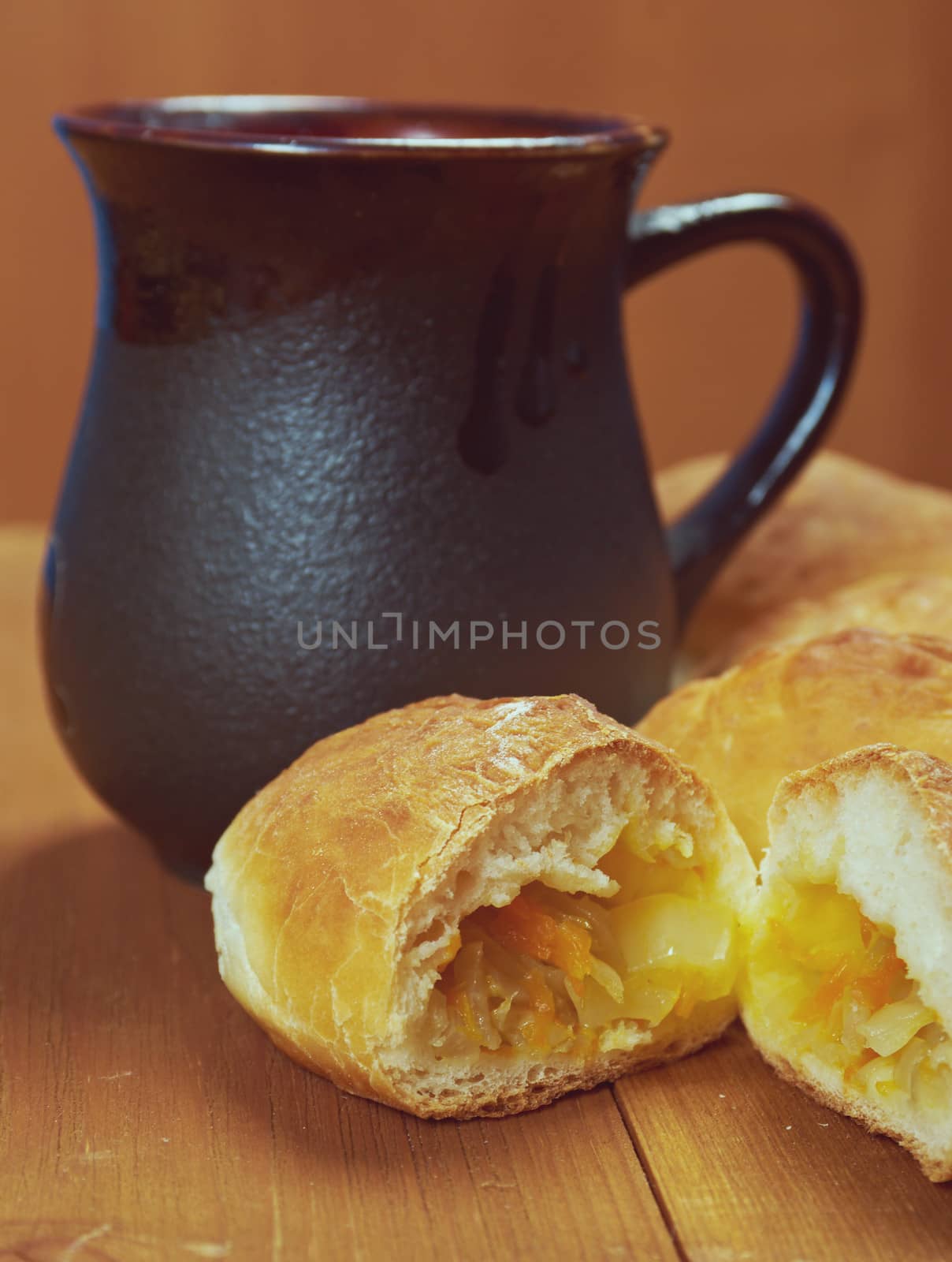 russia traditions pierogi .Home cake with cabbage against the wooden table