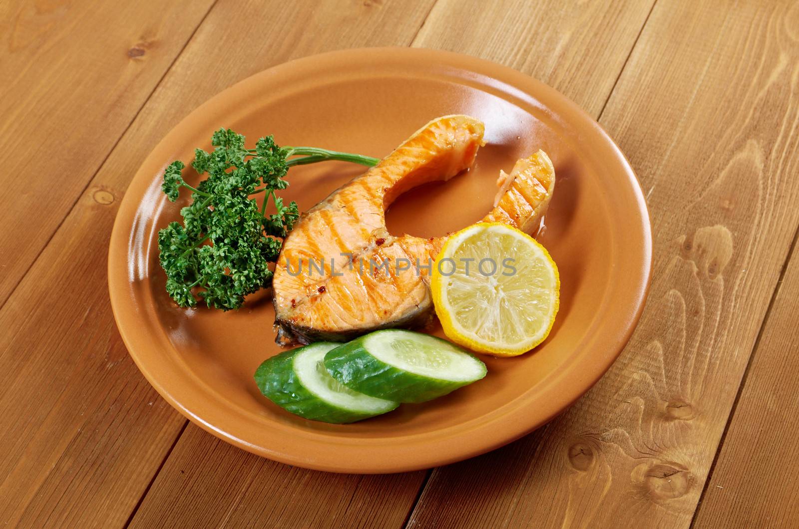 delicious grilled salmon steak with vegetables .closeup