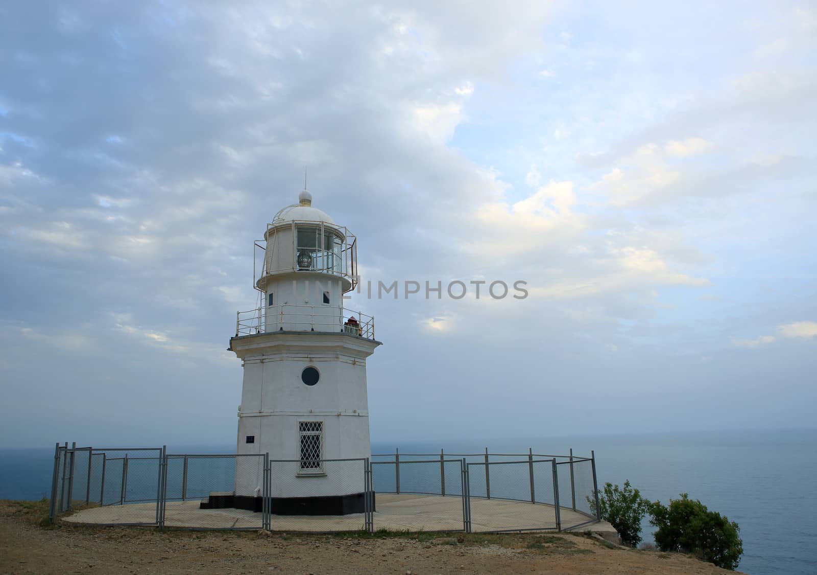 Lighthouse. The movement of clouds on the mountain Meganom, Crimea, Ukraine