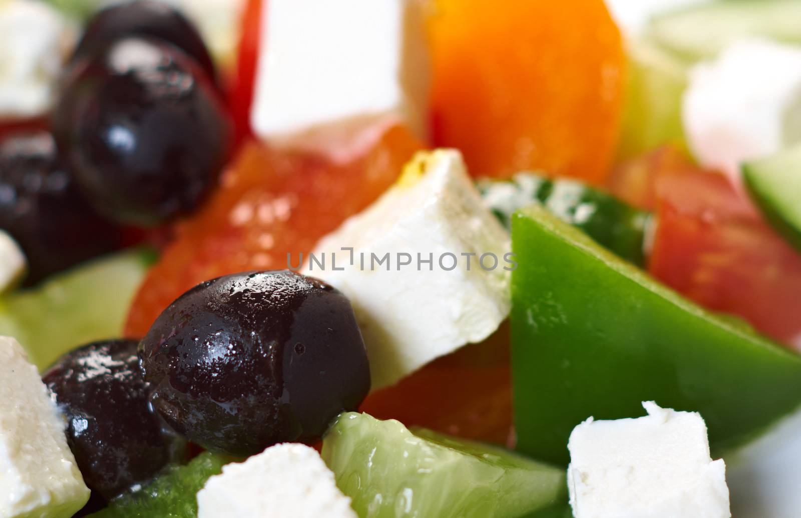 Greek salad with feta, tomatoes and black olives . selective focus