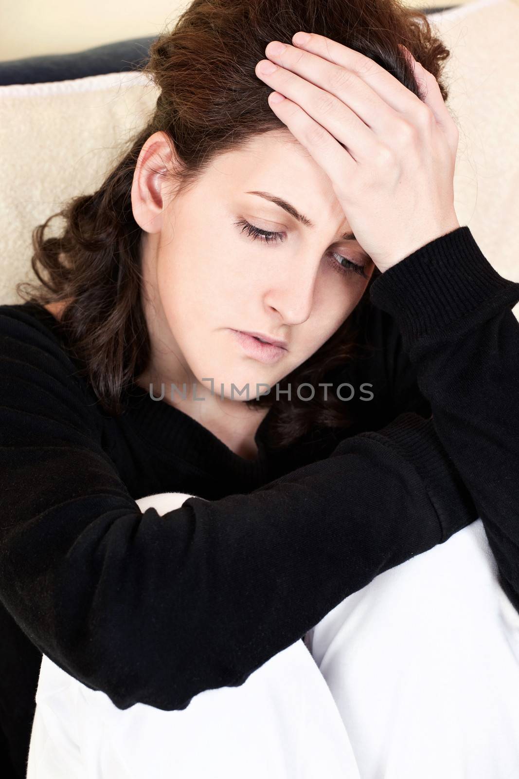 woman having headache at home