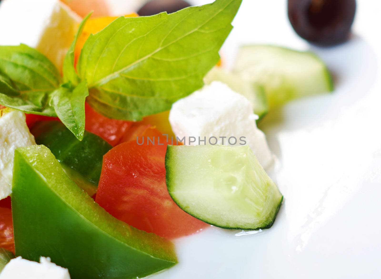 Greek salad with feta, tomatoes and black olives . selective focus