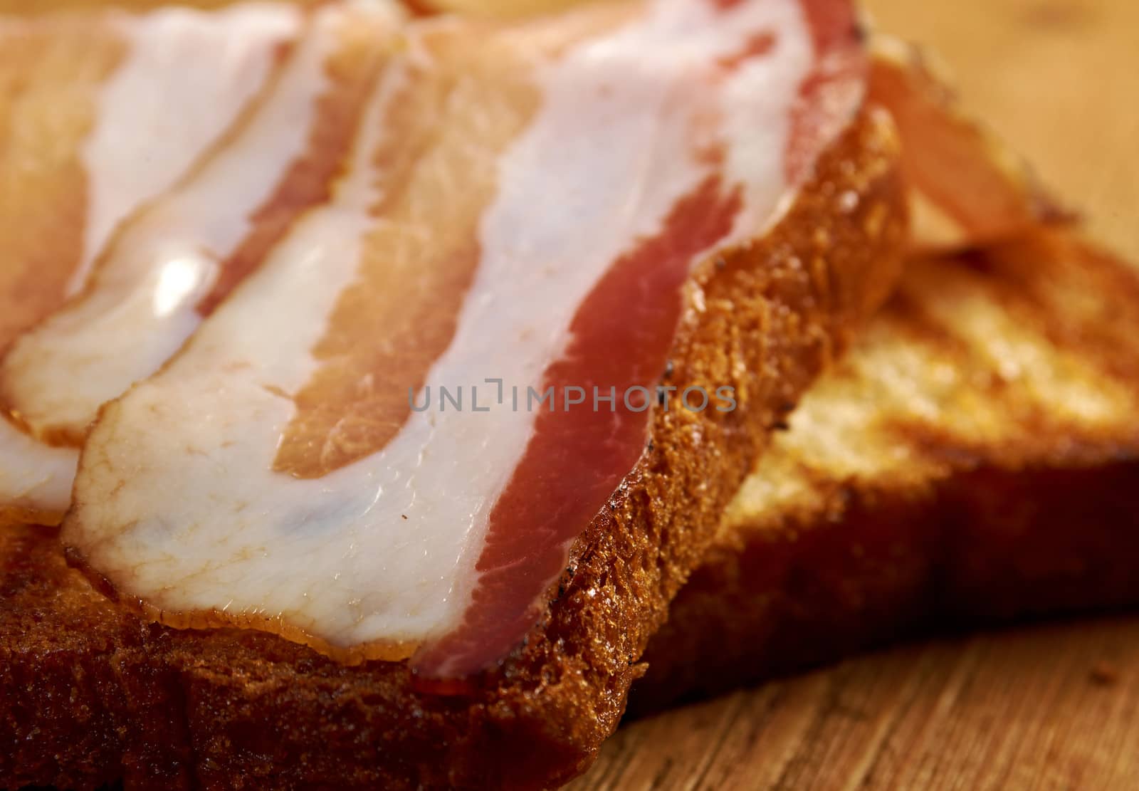 pile  toasted bread slices for bacon.Close up of toasted white bread in slices