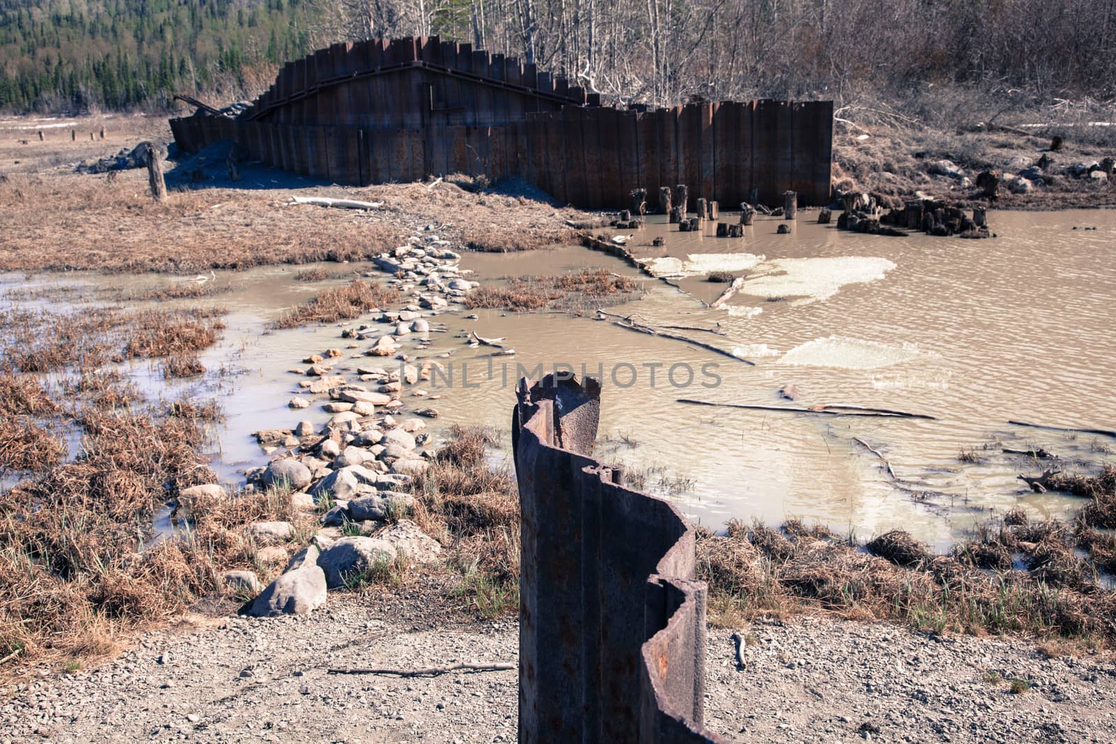 An old metal structure lies abandoned