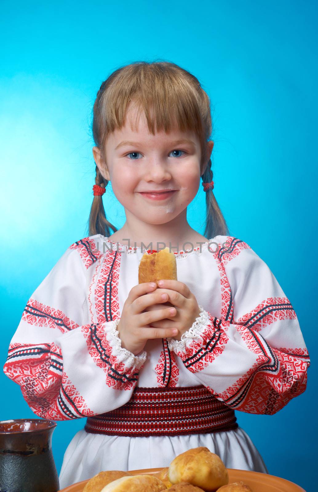 Russian little girl eats homemade pie