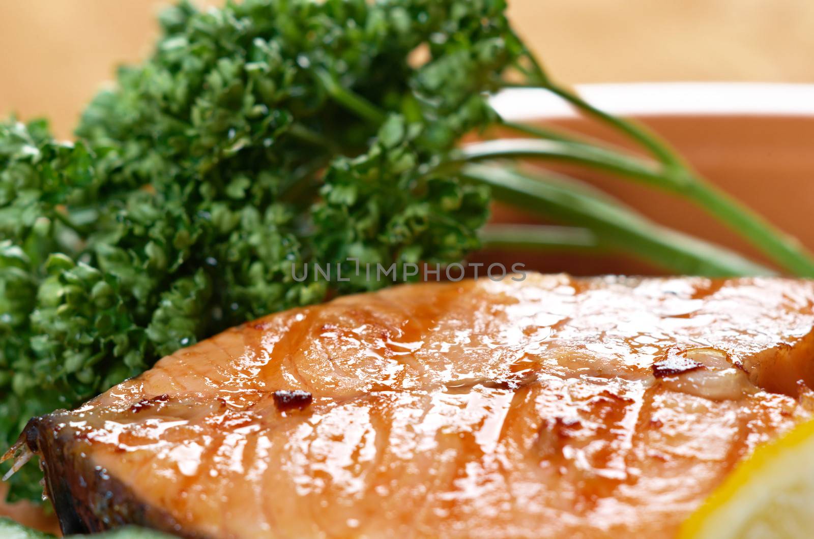 delicious grilled salmon steak with vegetables . Shallow depth-of-field