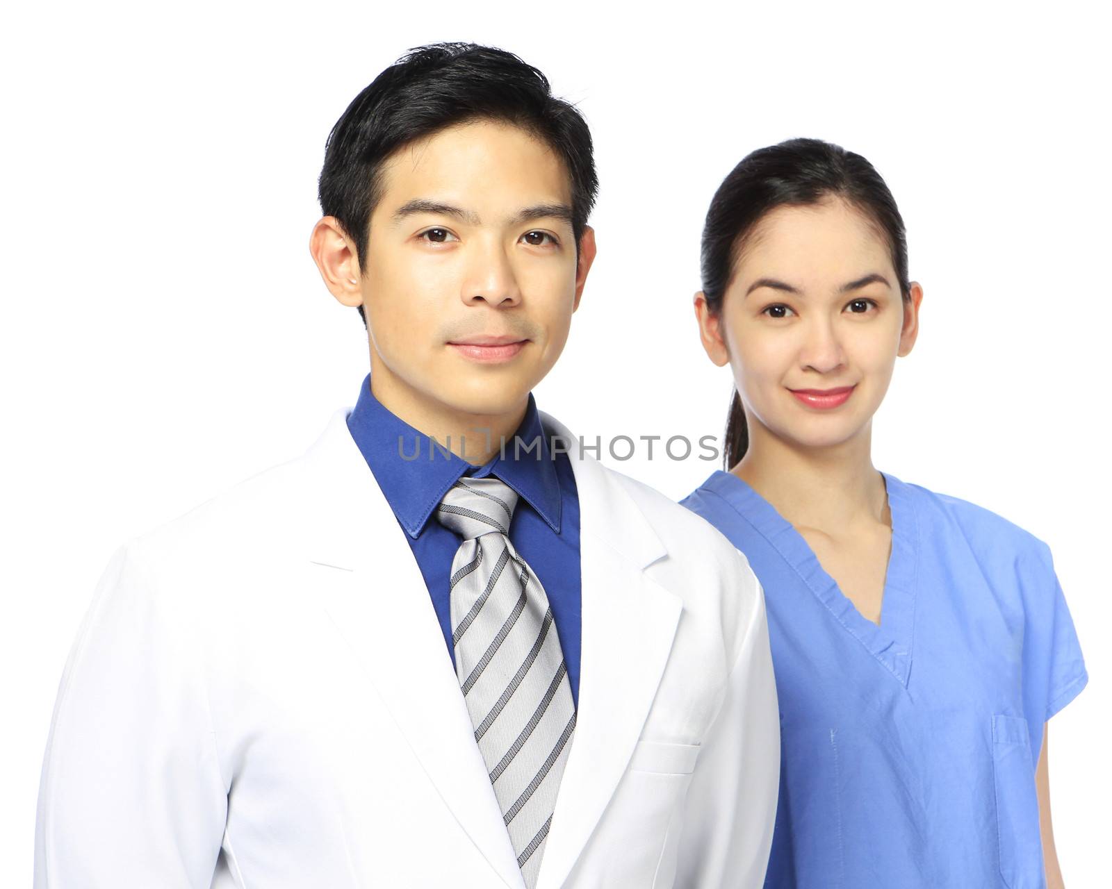 A man and a woman in medical attire. Shallow depth of field.