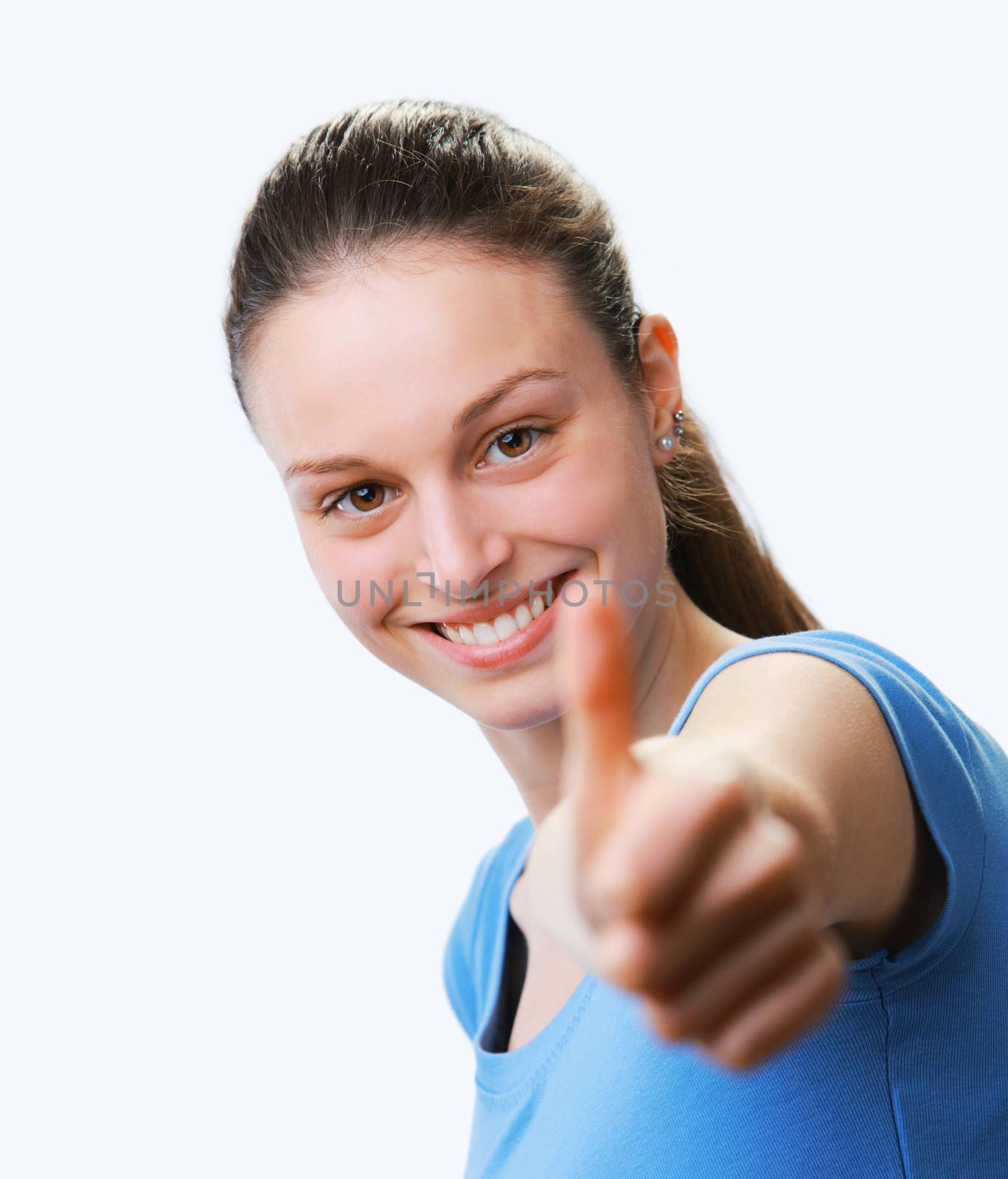 Closeup of a happy young woman showing thumb's up sign