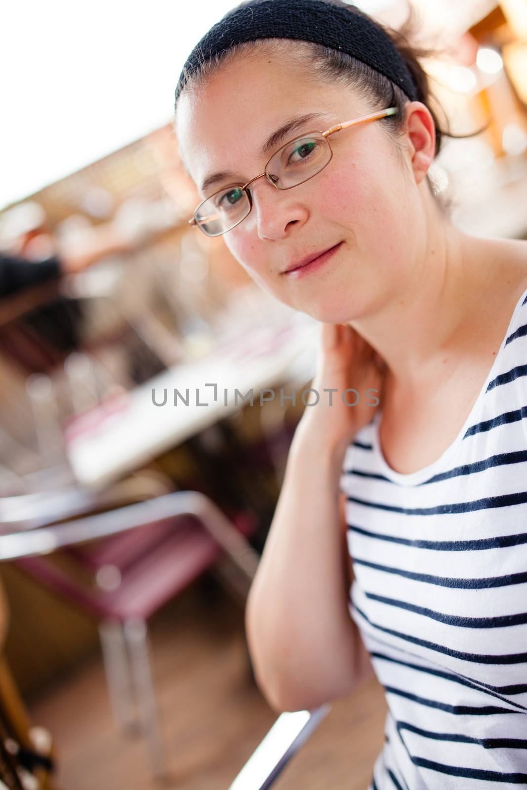 Woman sitting outside a restaurant