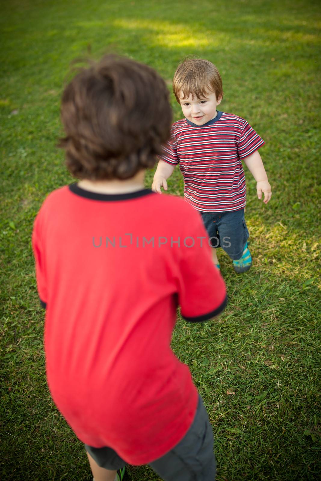 Two brothers playing together outside