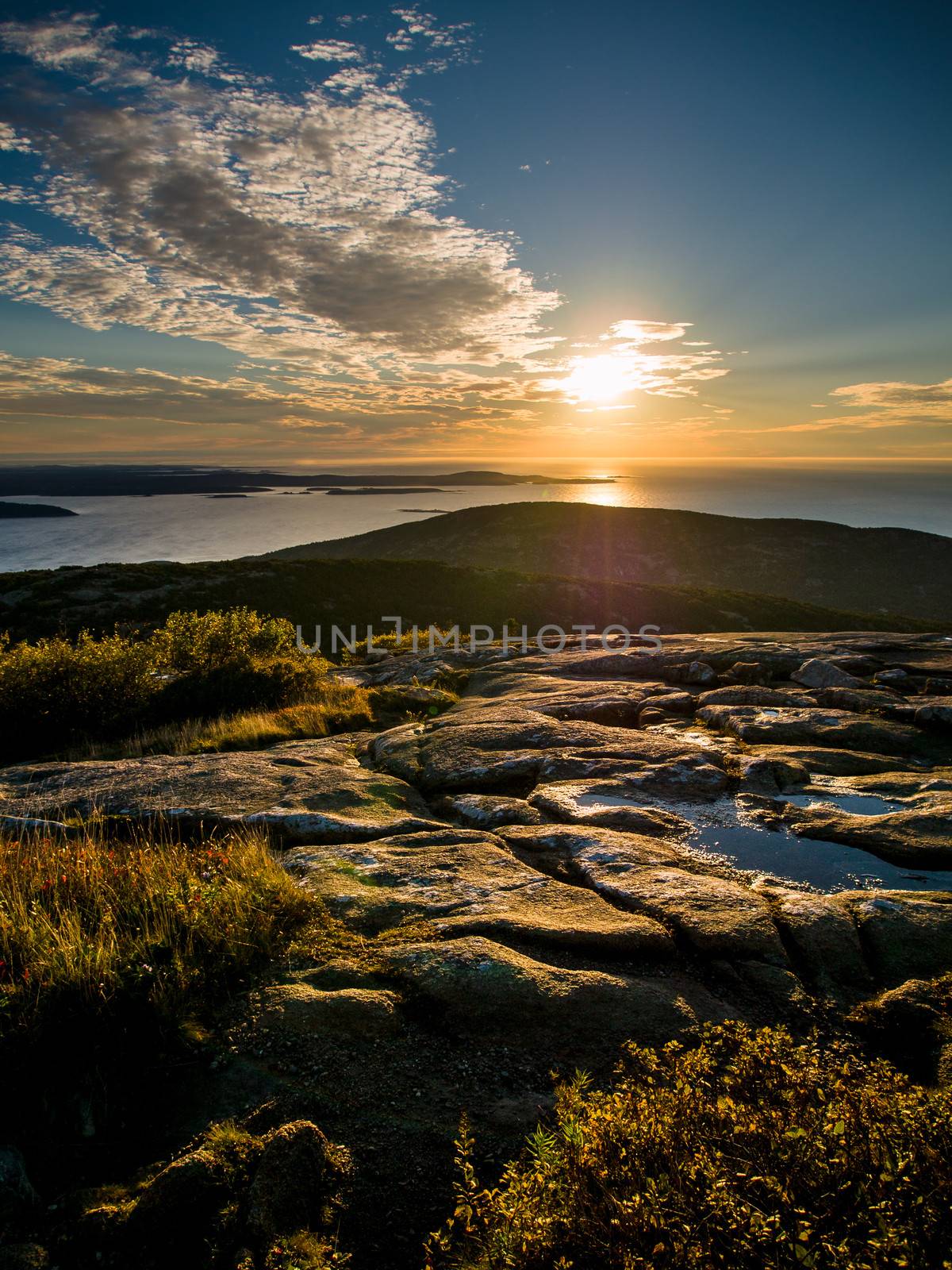 Sunrise over the sea on top of Cadillac Mountain in Acadia National Park