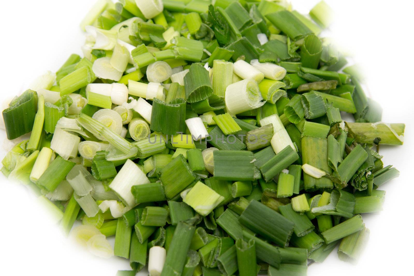 fresh chopped green onions isolated on white  by schankz