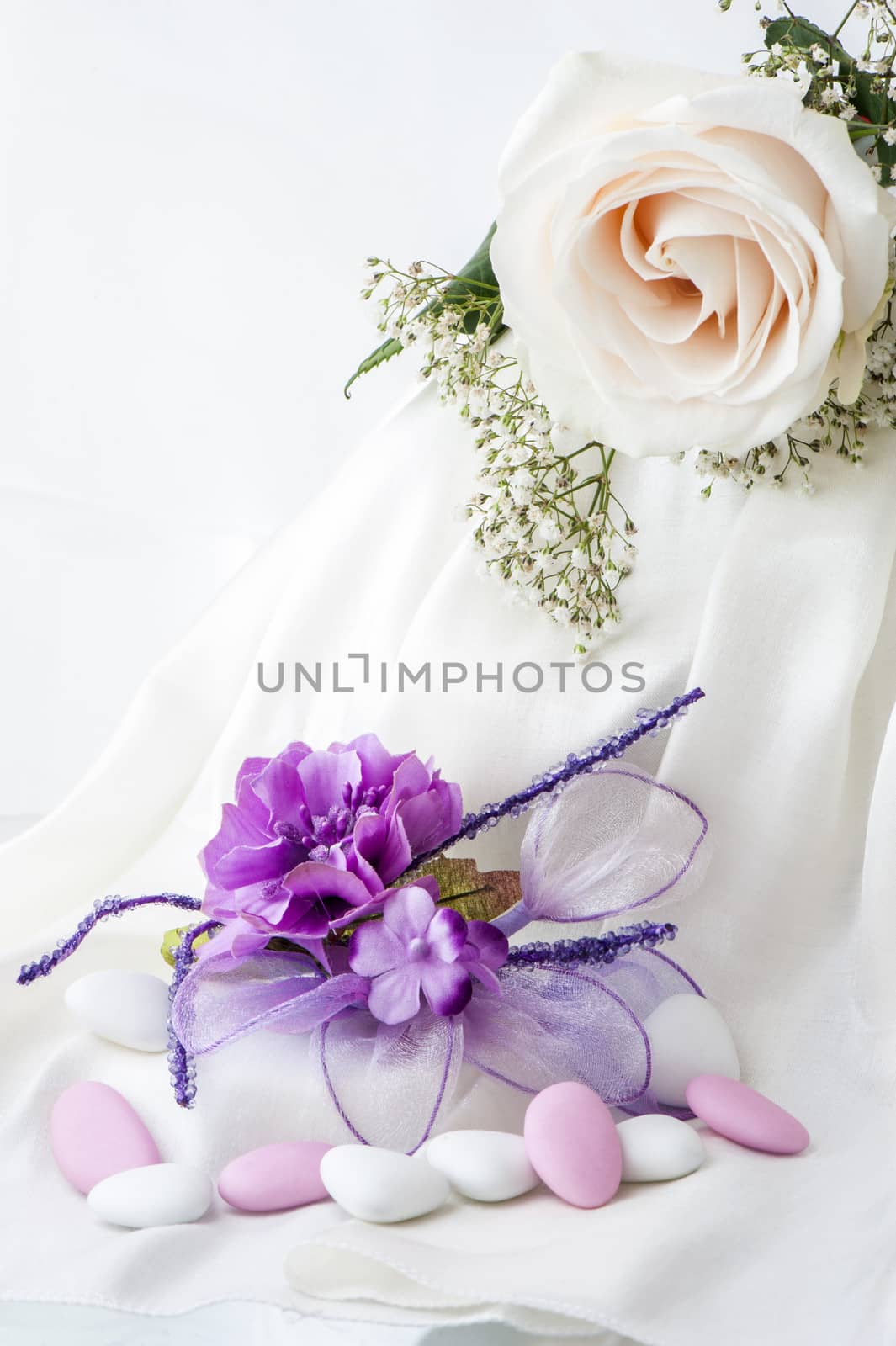 flowers candy and weddings favors on white background