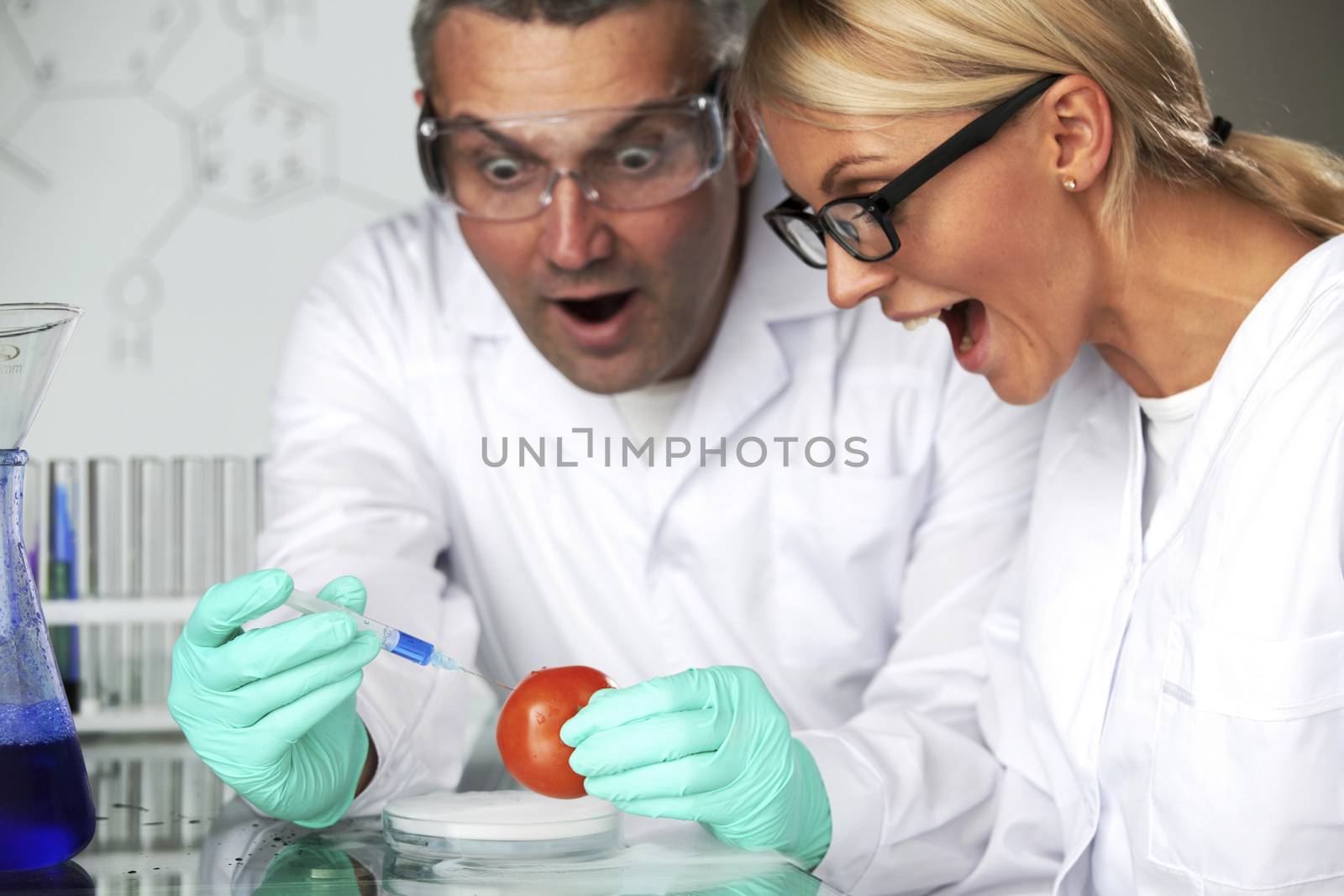 manand woman try to change tomato DNA