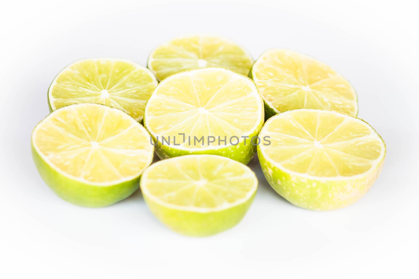 Half portion lime slice on white background