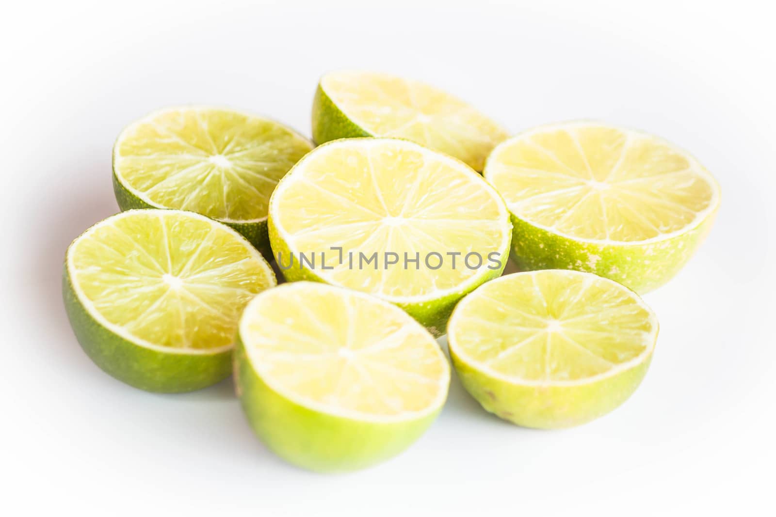 Fresh citrus lime half portion slice on white background by punsayaporn