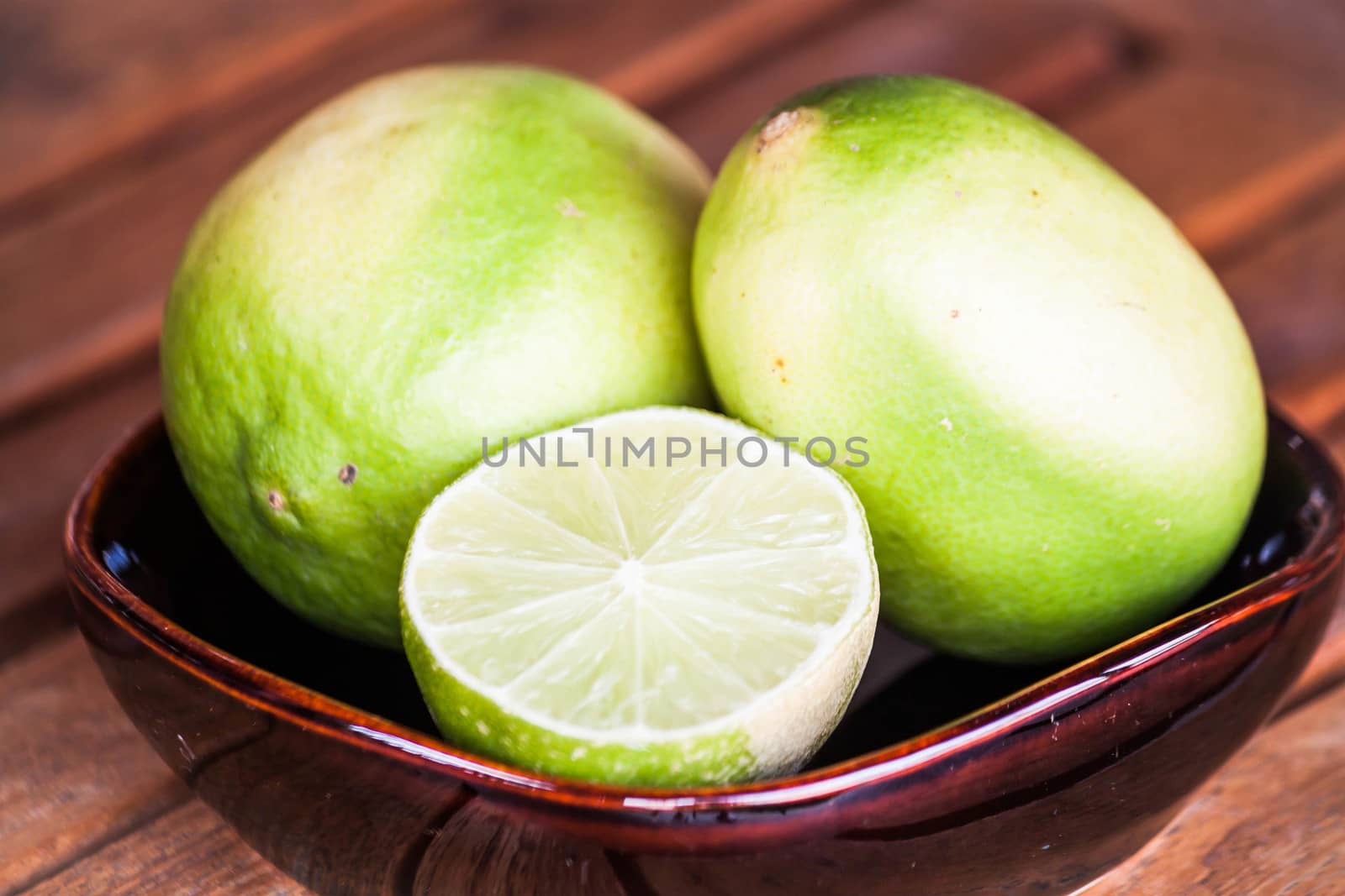 Close up fresh lime wholes and slice