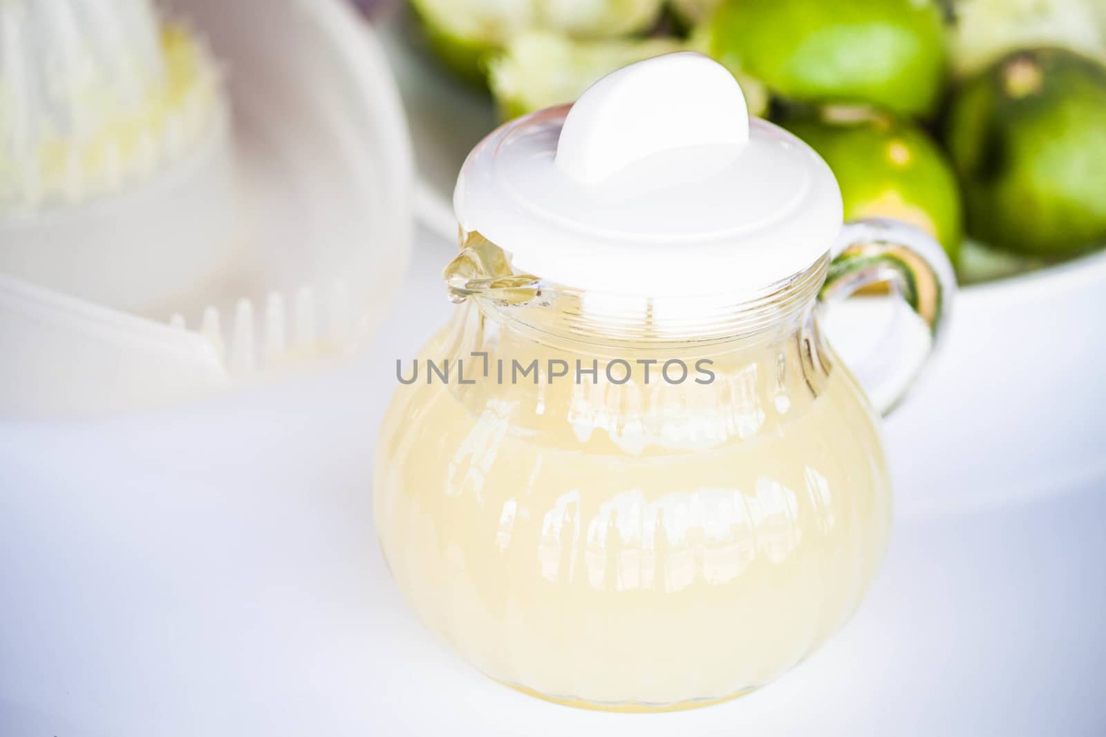 Fresh hand squashed lime juice in glass jar