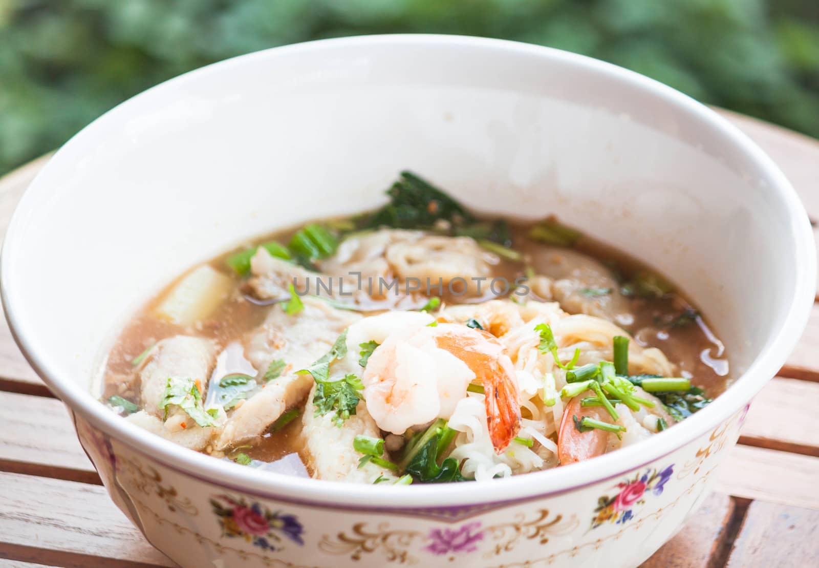 Thai spicy noodles  soup with pork and seafood