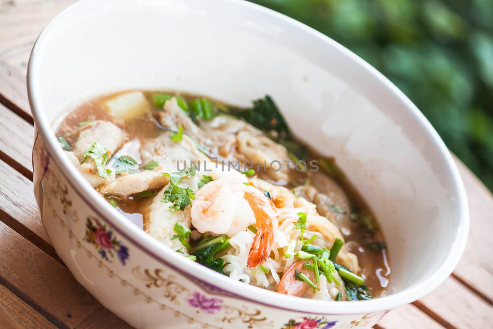 Thai noodles  with pork and seafood in spicy soup