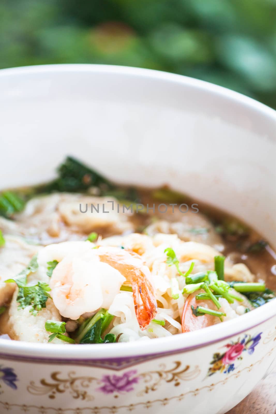 Close up shrimp topped on spicy noodles soup  by punsayaporn