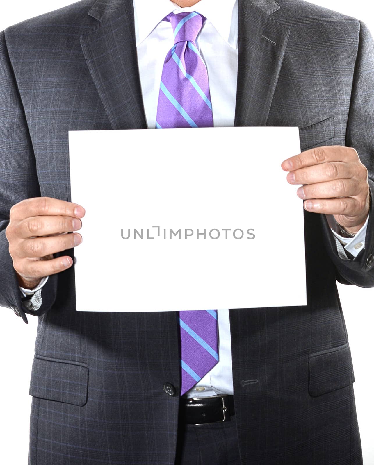 Businessman with purple tie holding a blank sheet of paper