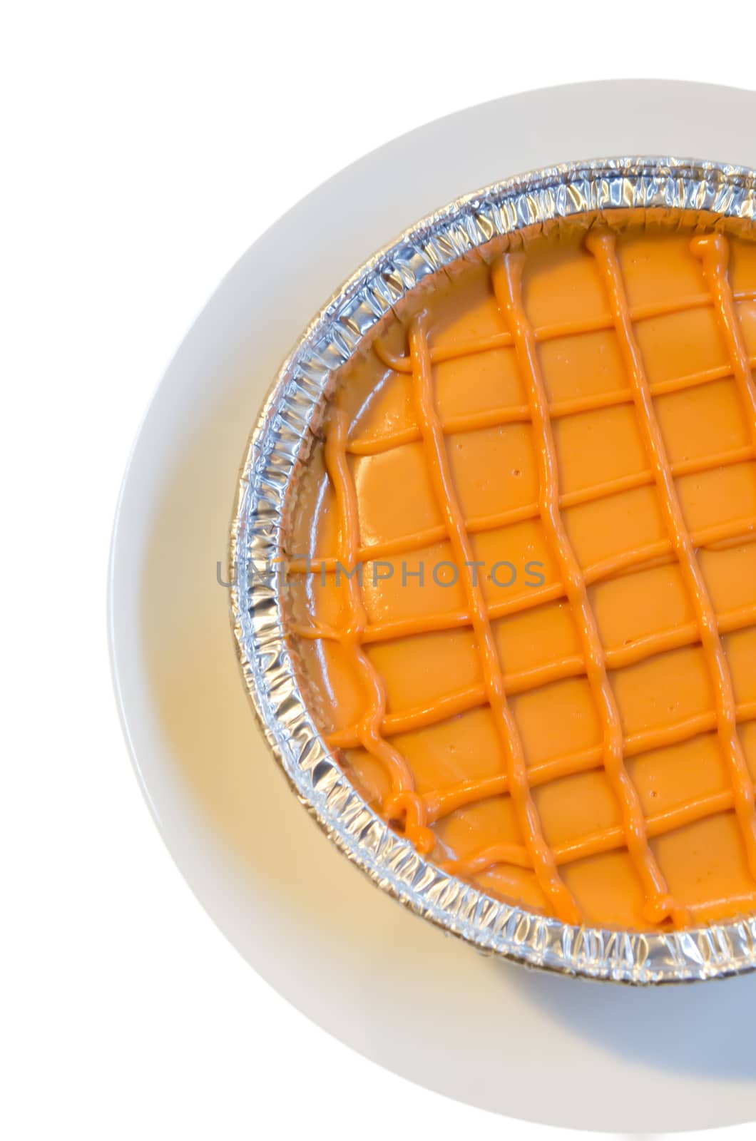 top view  thai tea sponge cake on white dish over white background