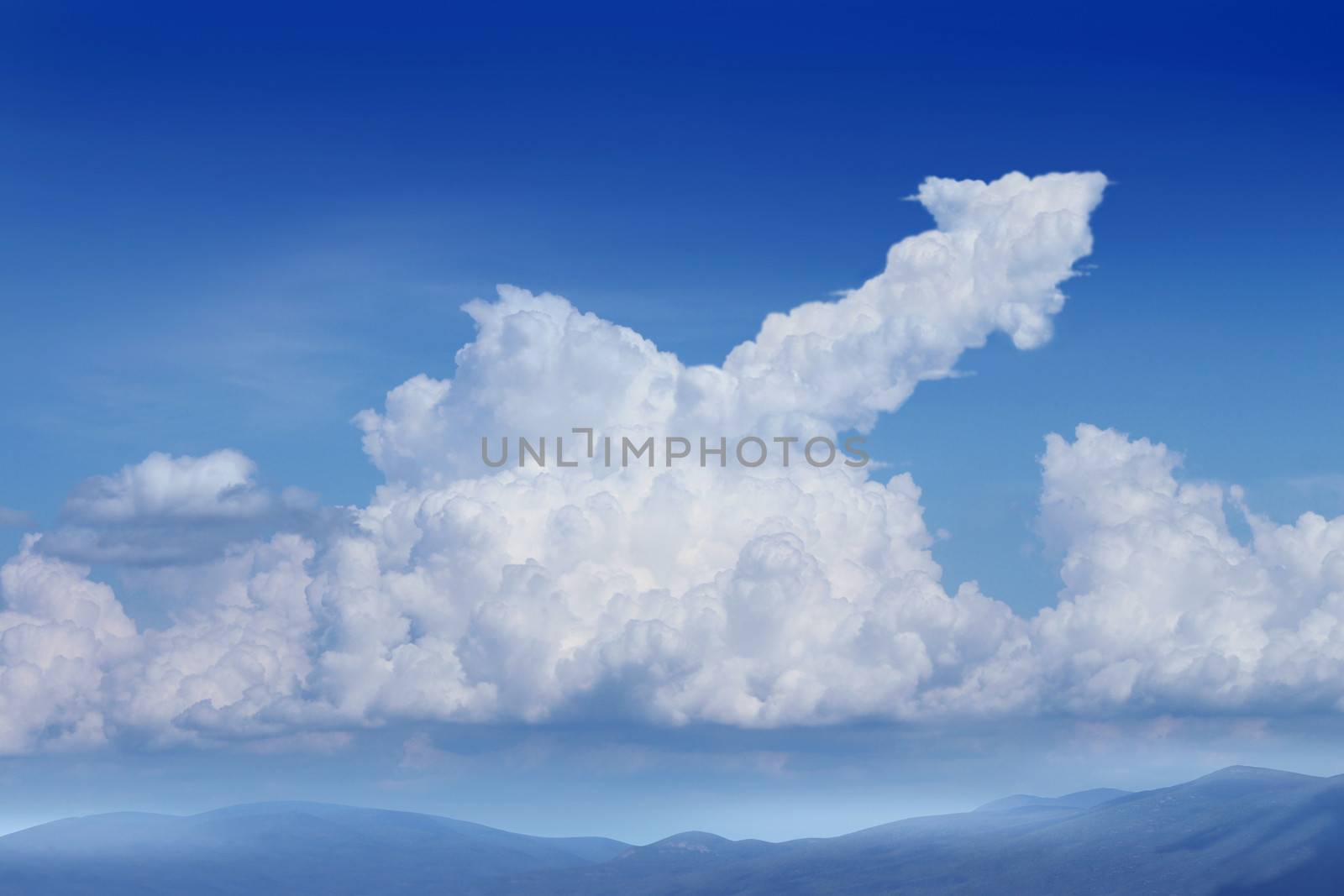 Success Dreams with a blue sky background and a cumulus cloud in the shape of an upward arrow as a financial concept for planning and dreaming about future strategy.