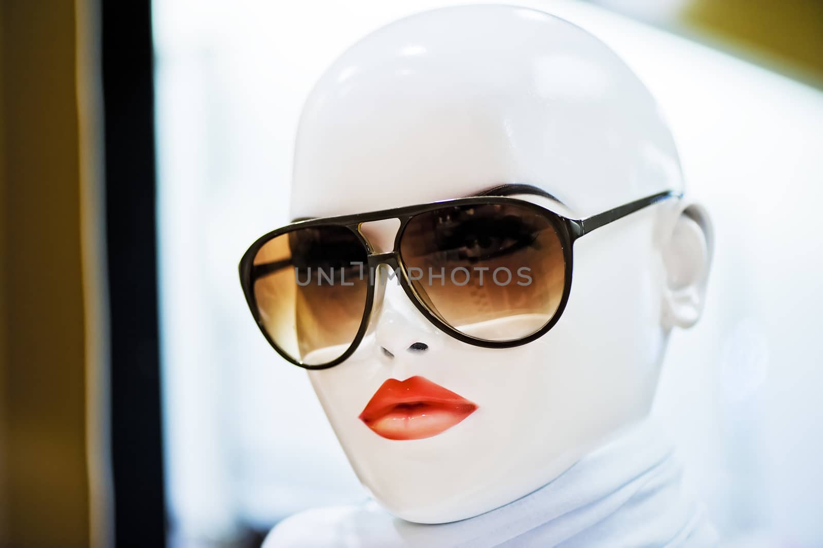Portrait of girl mannequin wearing sunglasses.
