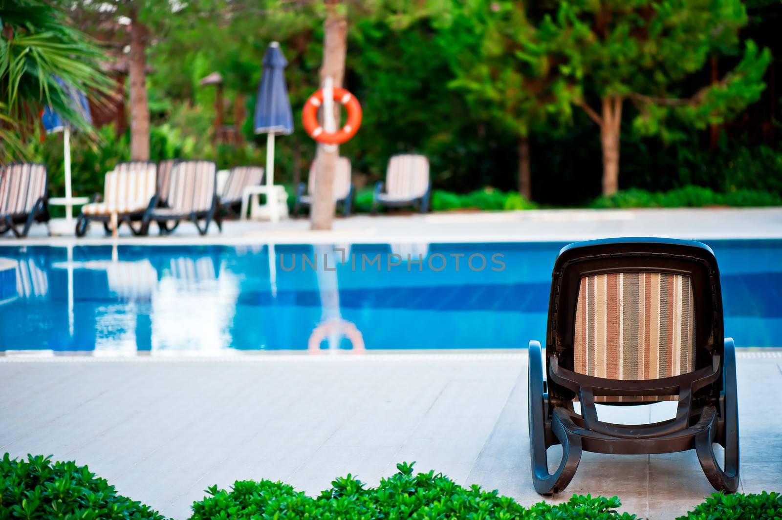 Chaise lounge by the pool to relax in the villa. by kosmsos111