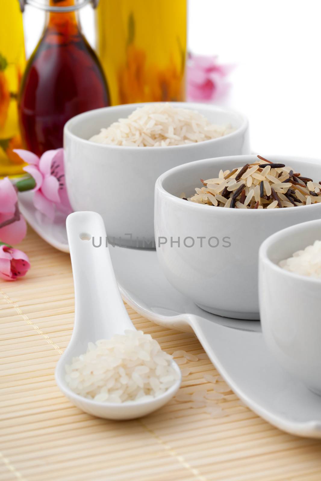 uncooked rice in porcelain spoon