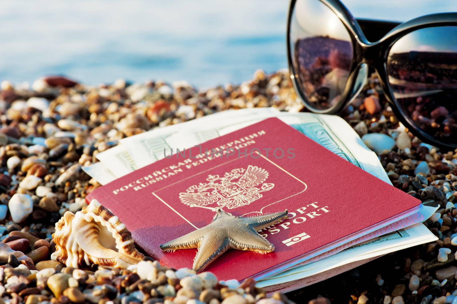 Still traveling with a Russian passport in the sand on the beach