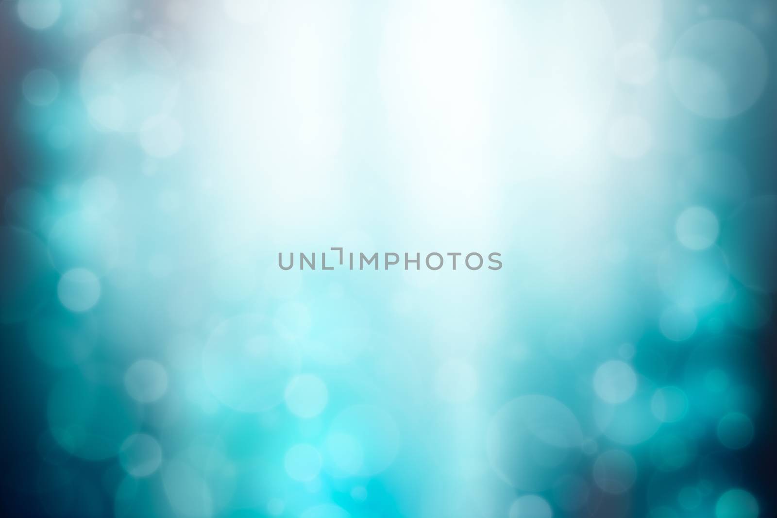 Blue abstract background with bokeh and sun rays