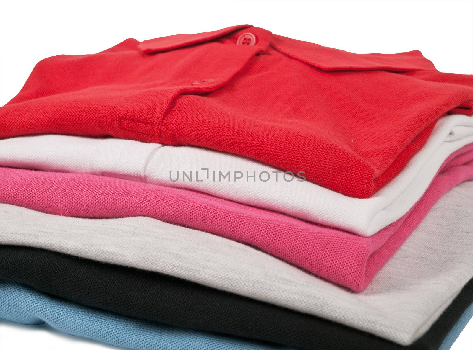 stack of man's and woman's polo t shirts