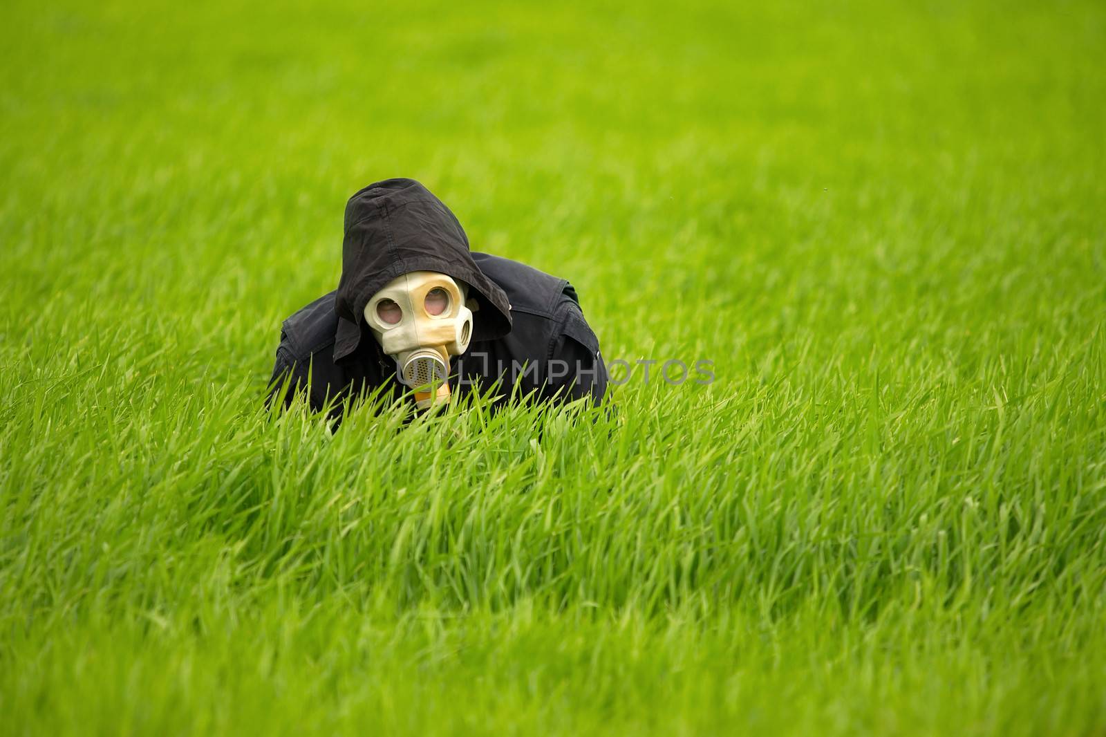Allergic man in gas mask in the grass