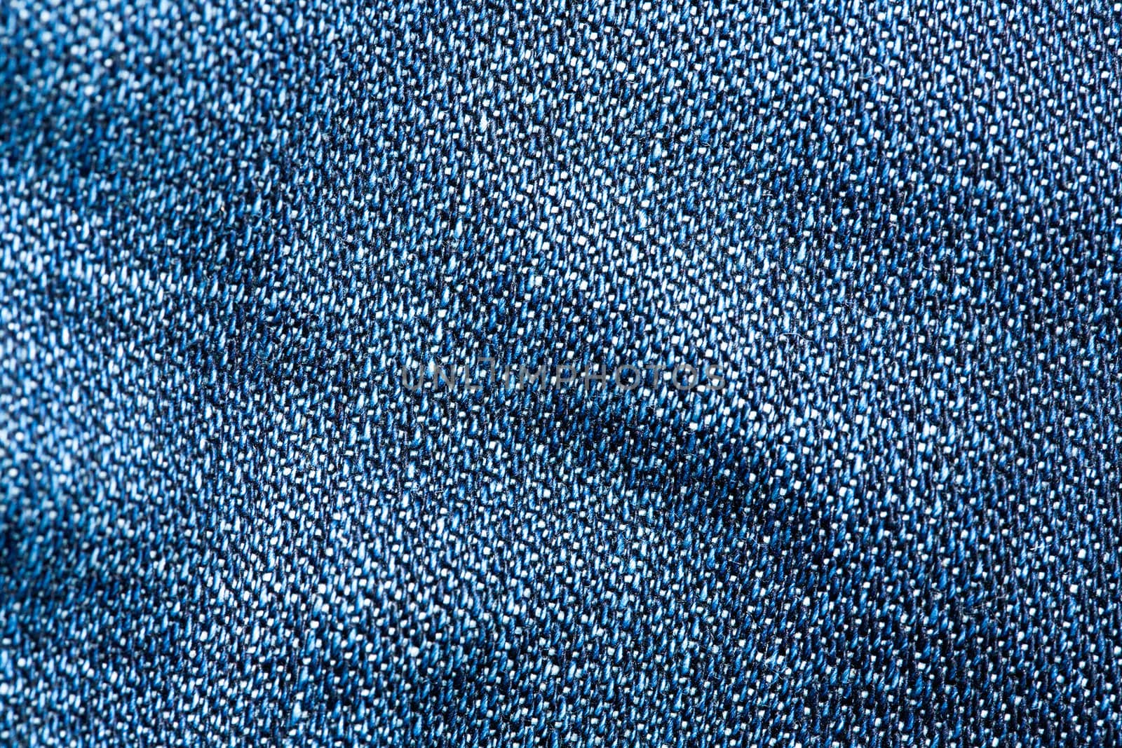 Striped textured blue jeans fabric background by sfinks