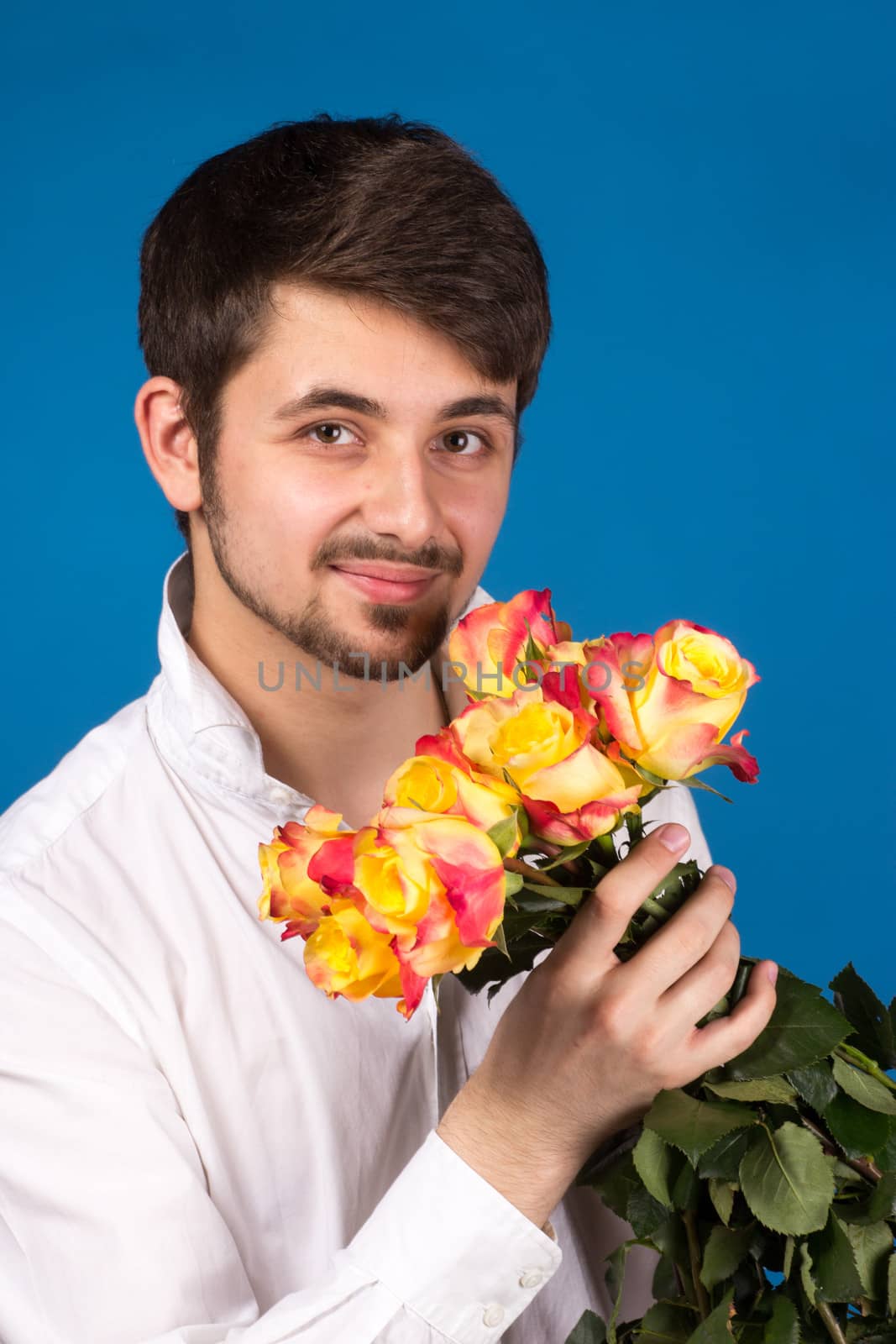 Man with bouquet of red roses by gsdonlin