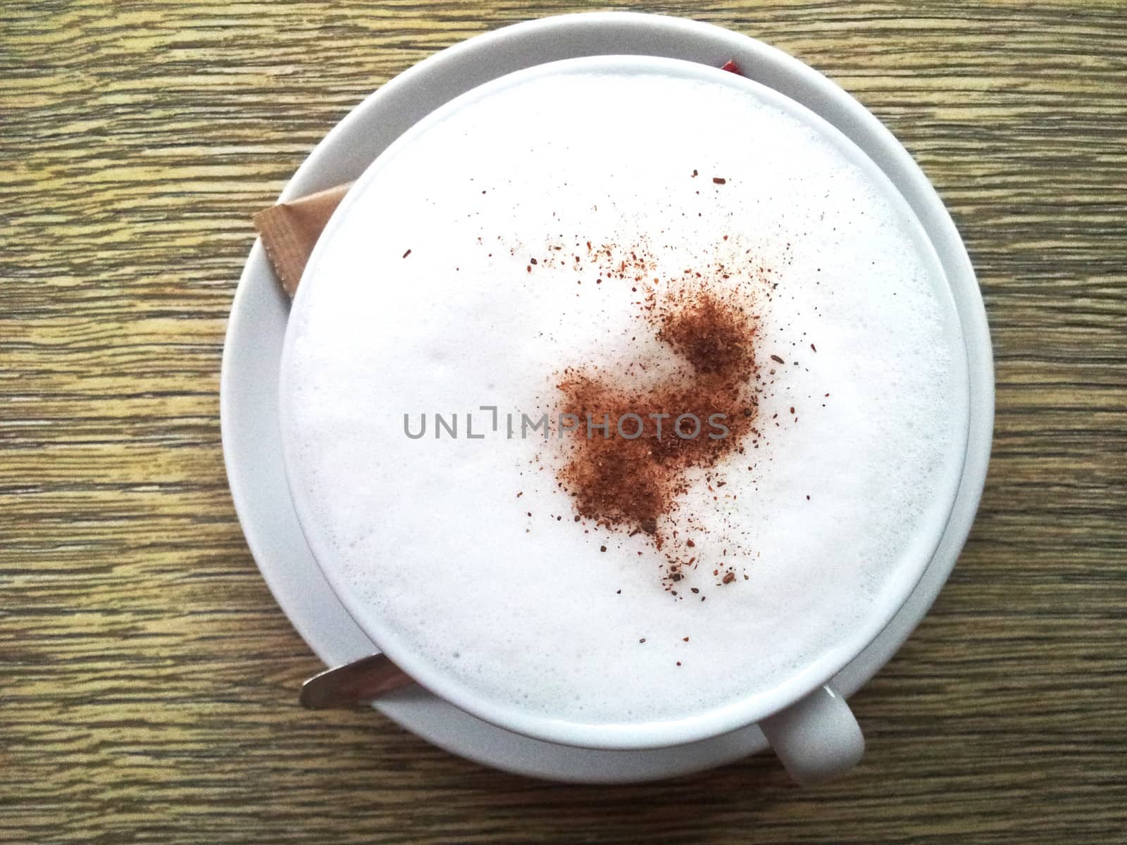 cappuccino cup on the wooden table