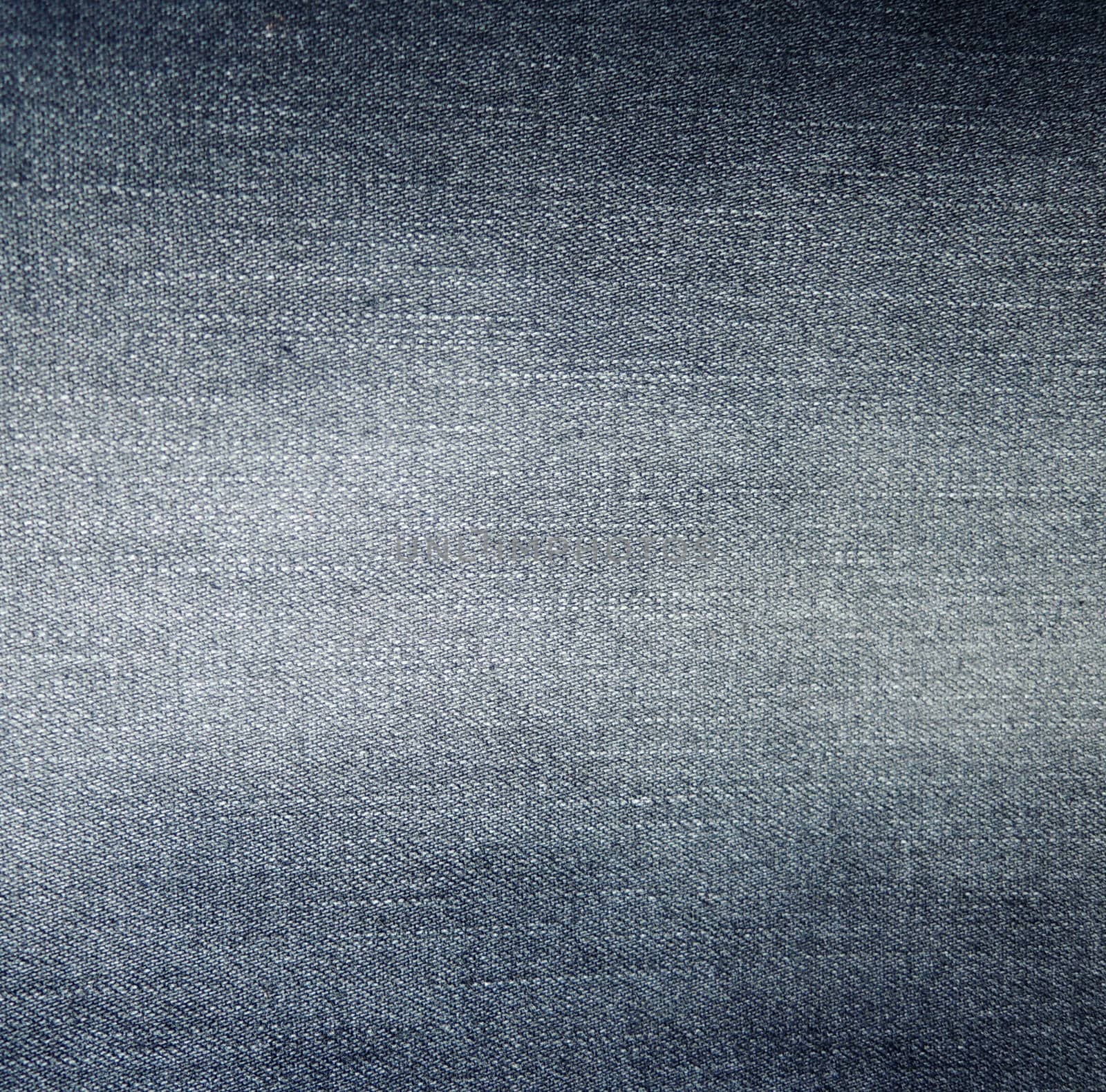 Dark jeans fabric with a visible structure as a background by MalyDesigner