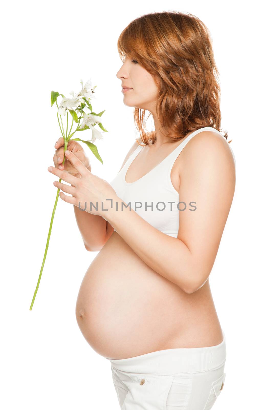 Pregnant woman holding flower isolated on white